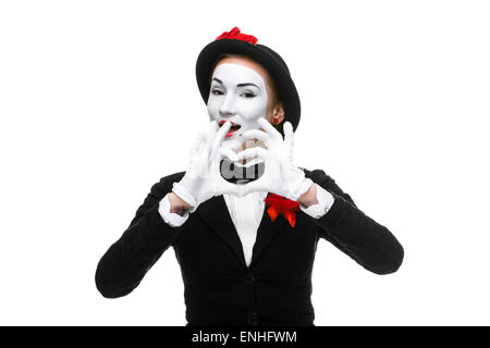 Portrait du mime avec les mains pliées en forme comme un coeur Banque D'Images