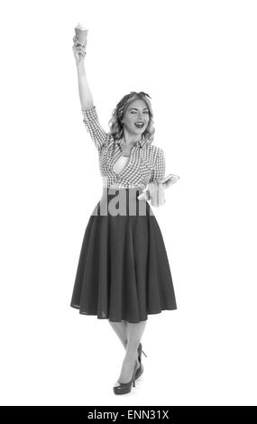 Blonde en une pose de Statue de la liberté sur fond blanc style Pin-up Banque D'Images