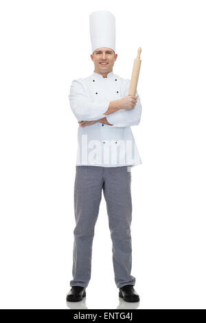 Happy male chef cook holding Rolling pin Banque D'Images