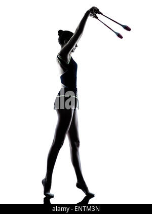 Un caucasian woman l'exercice de la gymnastique rythmique en silhouette isolé sur fond blanc Banque D'Images