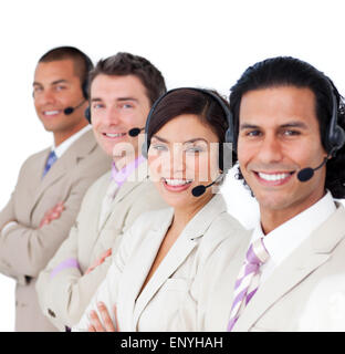 Smiling business team l'alignement avec le casque Banque D'Images