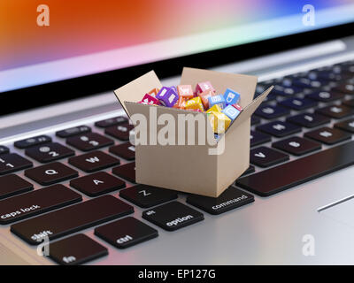 Boutons et icônes d'applications pour smartphone et tablette ordinateur en boîte en carton du clavier de l'ordinateur portable. Un logiciel d'applications mobiles Banque D'Images