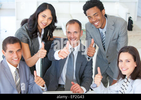 Business team with Thumbs up in office Banque D'Images