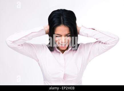 Businesswoman couvrant ses oreilles avec les mains sur fond gris Banque D'Images