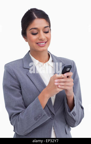 Female entrepreneur writing text message Banque D'Images