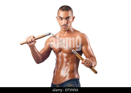 L'homme dans les arts martiaux concept avec nunchucks Banque D'Images