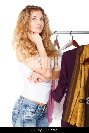 Portrait of a Girl selecting clothes in shop Banque D'Images