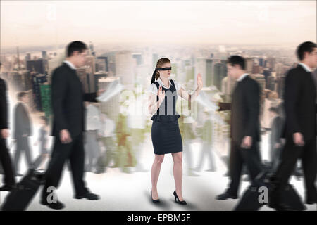 Image composite de redhead businesswoman dans un bandeau Banque D'Images