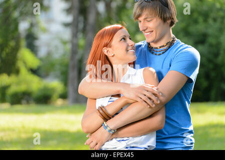 Teenage couple looking at each other Banque D'Images