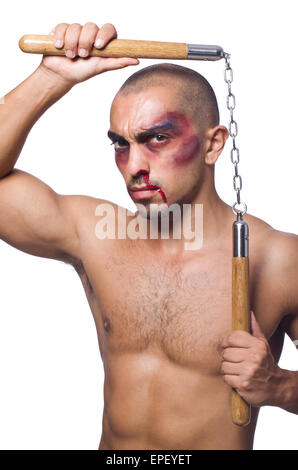 Homme avec nunchucks isolated on white Banque D'Images