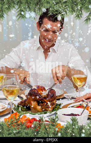 Composite image man eating turkey dans le dîner de Noël Banque D'Images