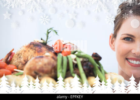 Portrait of woman showing poulet rôti Banque D'Images