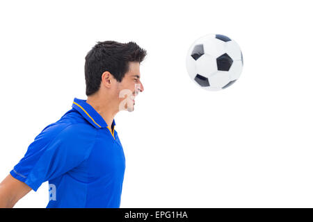 Joueur de football en-tête bleu ball Banque D'Images