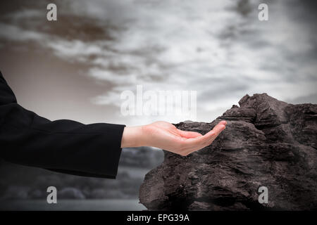 Image composite de businesswomans hand presenting Banque D'Images
