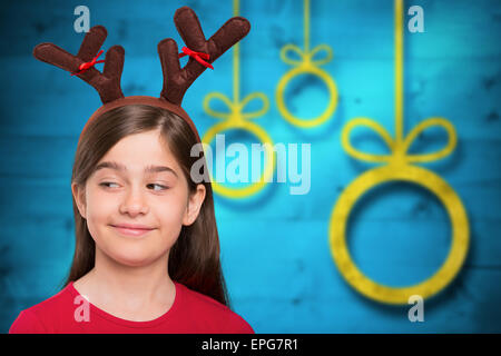 Image composite de bois little girl wearing festive Banque D'Images