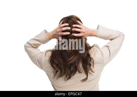 Young Asian businessman with hands on head standing back to camera Banque D'Images