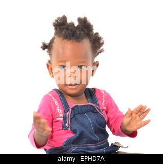 Young African baby girl having fun in photo studio Banque D'Images