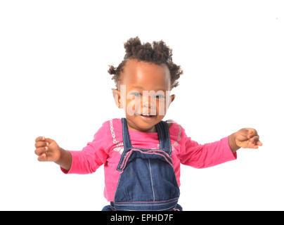 Young African baby girl having fun in photo studio Banque D'Images