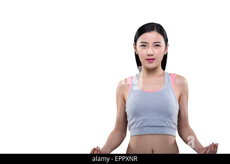 Young woman performing yoga Banque D'Images