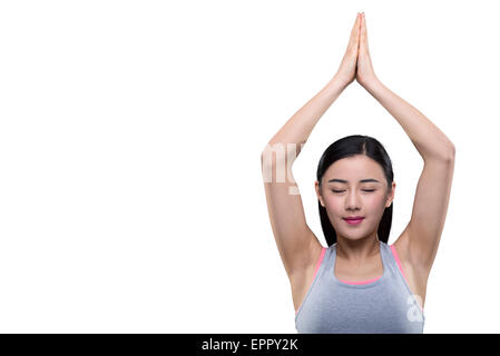 Young woman smiling avec les mains au-dessus de la tête Banque D'Images