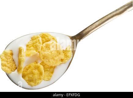 Cornflakes dans la cuillère en argent sur fond blanc. Fichier contient des chemins de détourage. Banque D'Images
