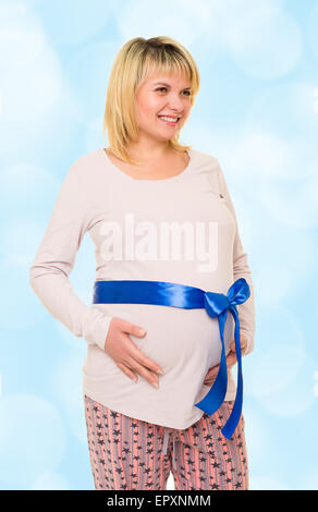 Pregnant woman with blue bow Banque D'Images