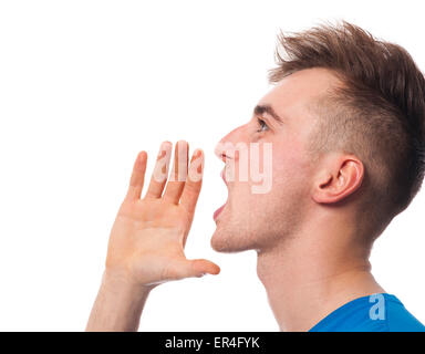 Jeune homme posant contre un fond blanc Banque D'Images