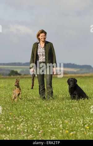 Huntsman avec chien et fauve Banque D'Images