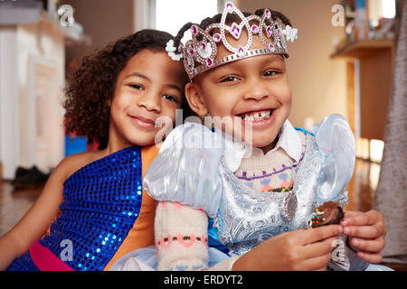 Smiling girls playing Dress-up Banque D'Images