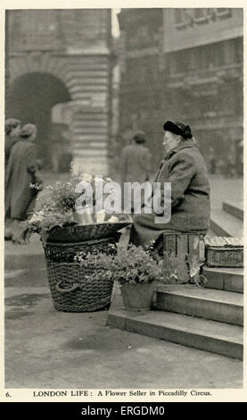 Une marchande de fleurs à Piccadilly Circus, Londres. Banque D'Images