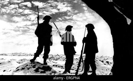 La DEUXIÈME GUERRE MONDIALE - Silhouettes de trois soldats avec des baïonnettes dans la neige, Front de l'Ouest. Sous-titre suivant : ' La montre continue : Coucher de Soleil sur le front de l'Ouest, mais encore la Grande-Bretagne monte la garde.' War Office officiel photographie. Banque D'Images