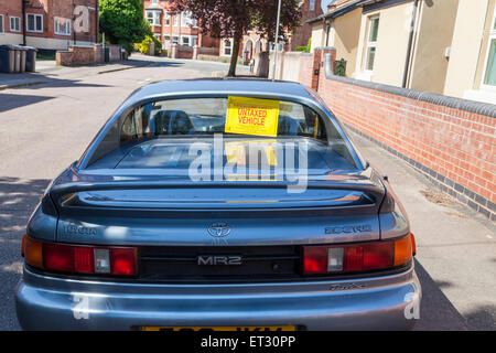 Voiture sans taxe. Véhicule non taxés avis sur le dos d'une voiture en raison de la taxe impayée, Lancashire, England, UK Banque D'Images