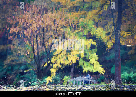 Réflexions de pont et arbres d'or dans un étang. Ressemble à la peinture impressionniste. Banque D'Images