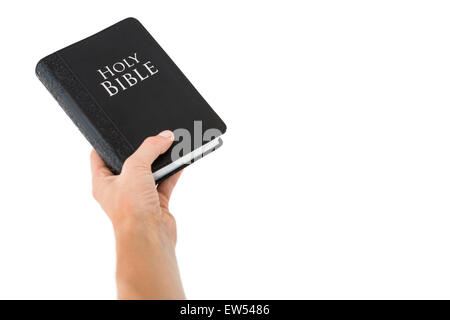 Hand holding bible Banque D'Images