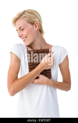 Attractive Woman hugging barre de chocolat Banque D'Images