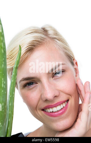 Attractive Woman holding aloe vera Banque D'Images