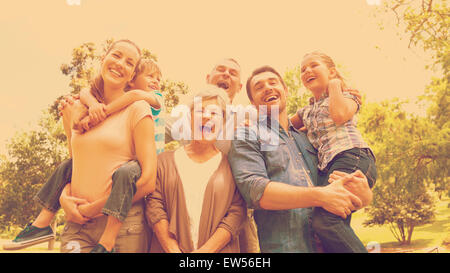 Portrait of cheerful extended family at park Banque D'Images