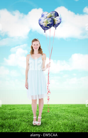 Libre de hipster woman holding balloons Banque D'Images