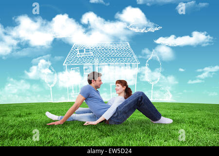 Image composite de couple assis sur le plancher Banque D'Images