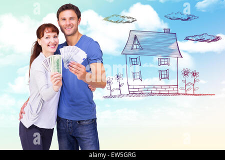 Image composite du couple holding fans de paiement Banque D'Images