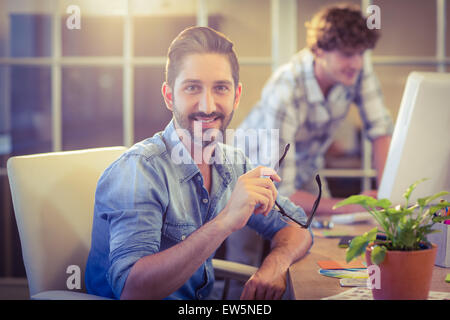 Designer Happy smiling at camera Banque D'Images