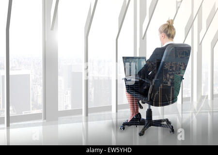 Image composite de businesswoman looking at camera Banque D'Images