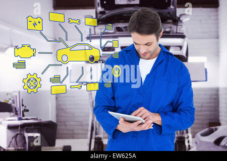 Image composite de mechanic using digital tablet over white background Banque D'Images