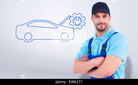 Portrait of male handyman dans une combinaison de standing arms crossed Banque D'Images