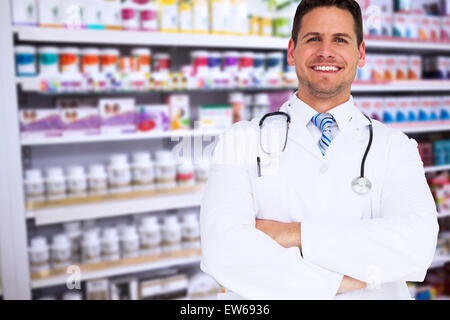 Image composite de handsome doctor with arms crossed Banque D'Images