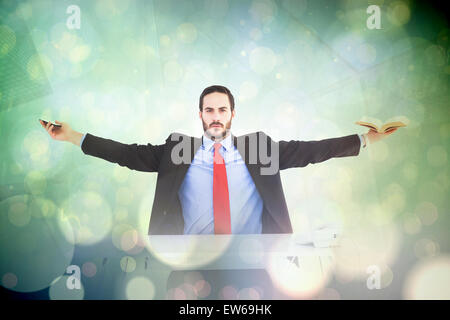 Composite image of businesswoman sitting with arms outstretched Banque D'Images