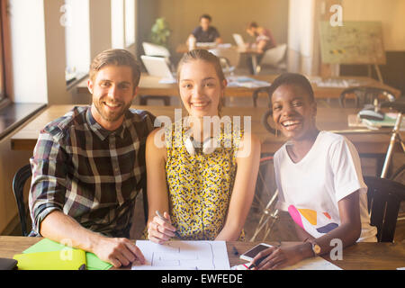 Portrait smiling creative business people working in office Banque D'Images