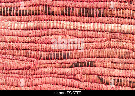 Vieux tapis rouge texture background Banque D'Images