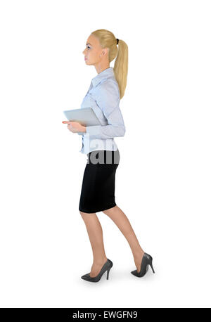 Business Woman with tablet walking Banque D'Images