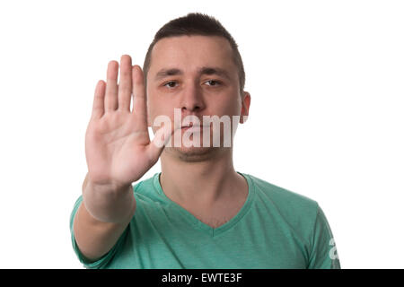 Portrait d'un beau jeune homme fait un symbole d'arrêt - Isolé sur fond blanc Banque D'Images